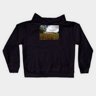 Autumn leaves in front of South Hill Park Arts centre Kids Hoodie